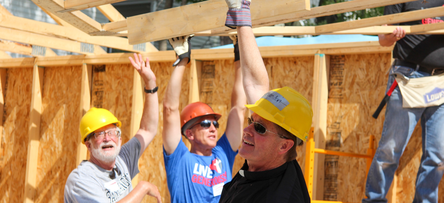Fr. Tim Kitzke & Fr. Bob Stiefvater raise the roof with Thrivent Members